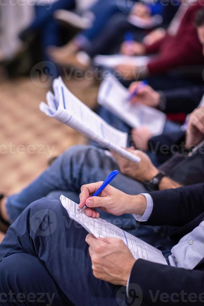 business people taking notes photo