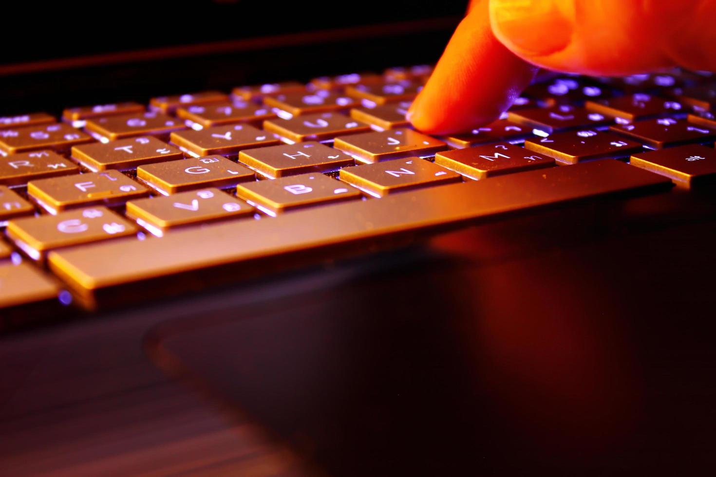 man using laptop, searching web, browsing information, having workplace at home, soft focus picture, Vintage concept, night photo