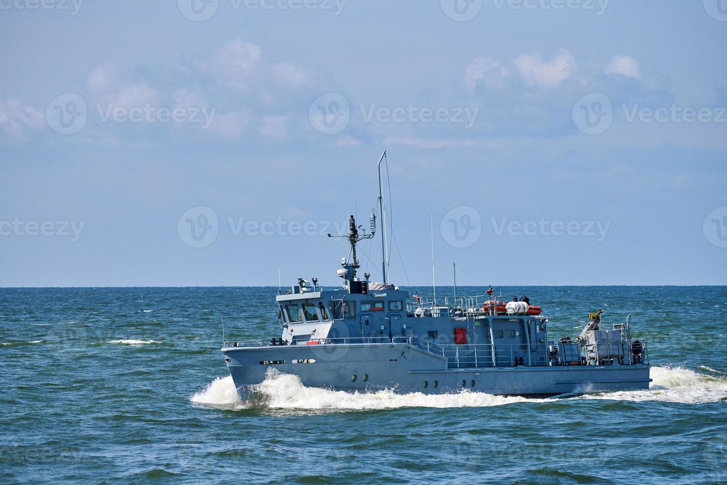 Coastguard, rescue support patrol boat for defense, military ship on high blue seas, Russian Navy photo