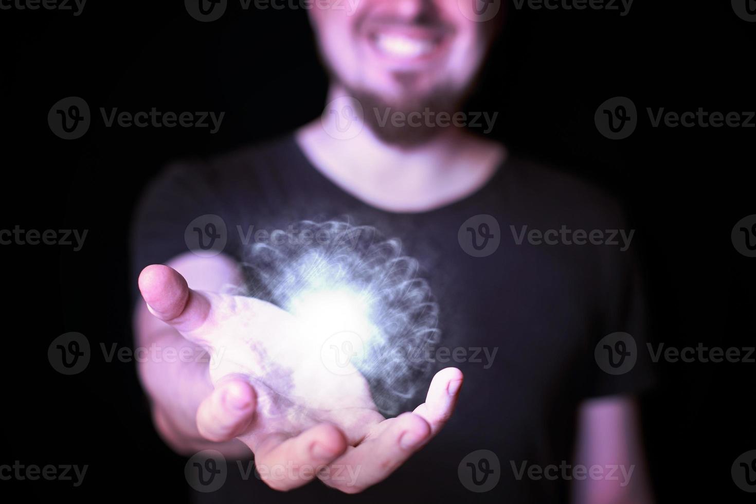 Magic ball in bearded wizard hand photo