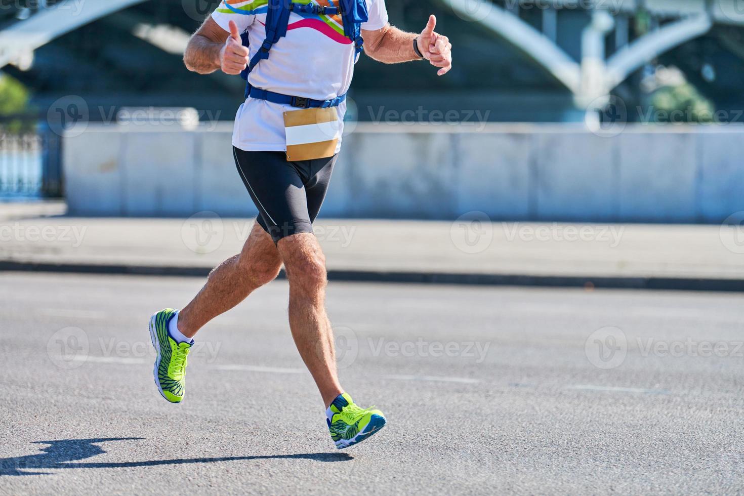 Running man on street road photo