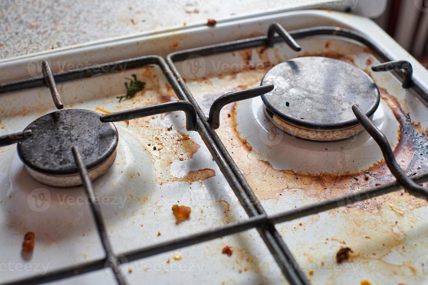 Dirty stove with food leftovers photo