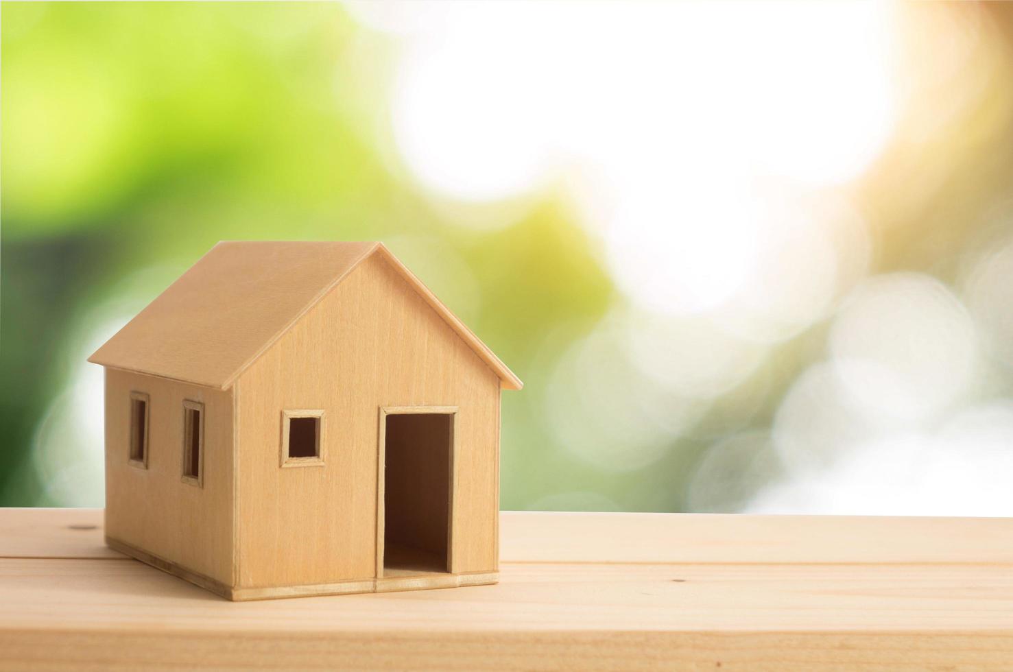 Model house on wooden table photo