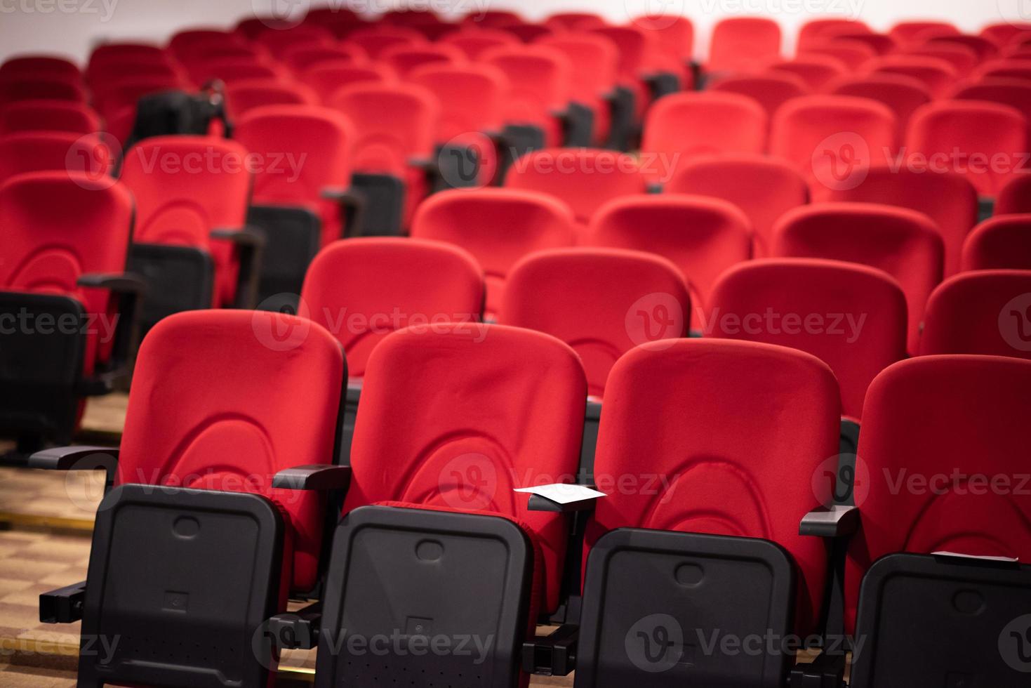hall with rows of red seats photo