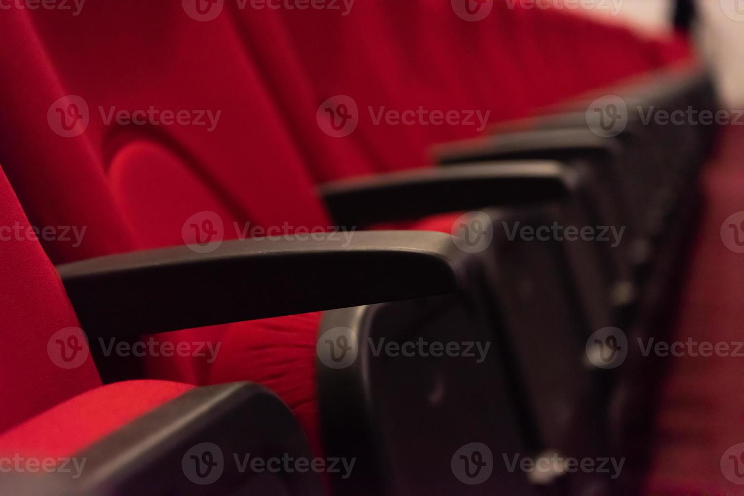 hall with rows of red seats photo