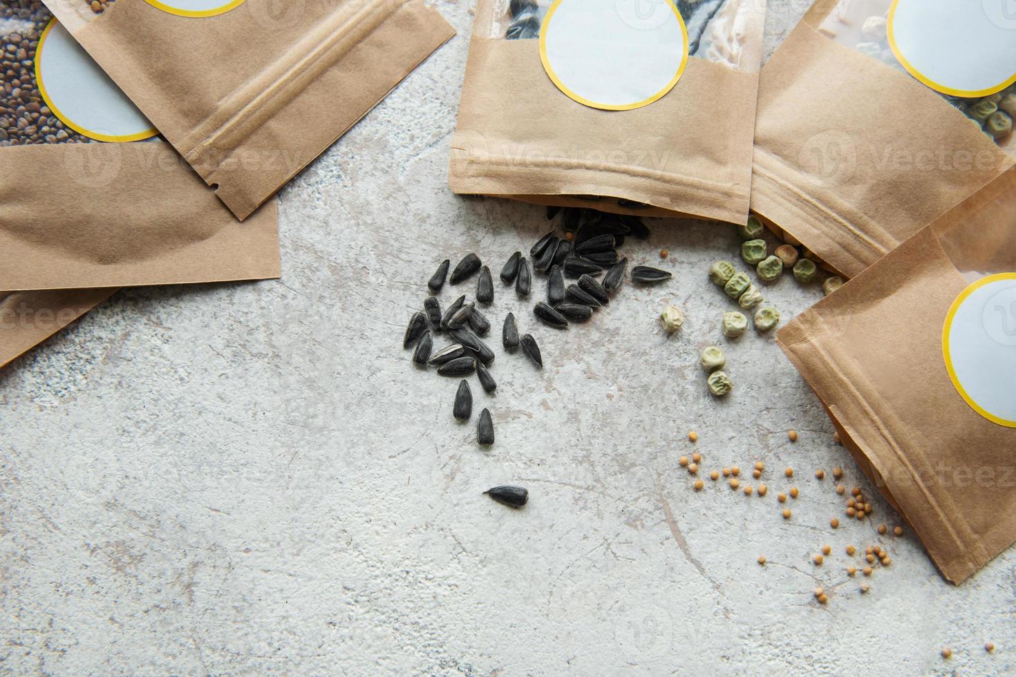 Microgreen seeds in paper bags and equipment for sowing microgreens. photo