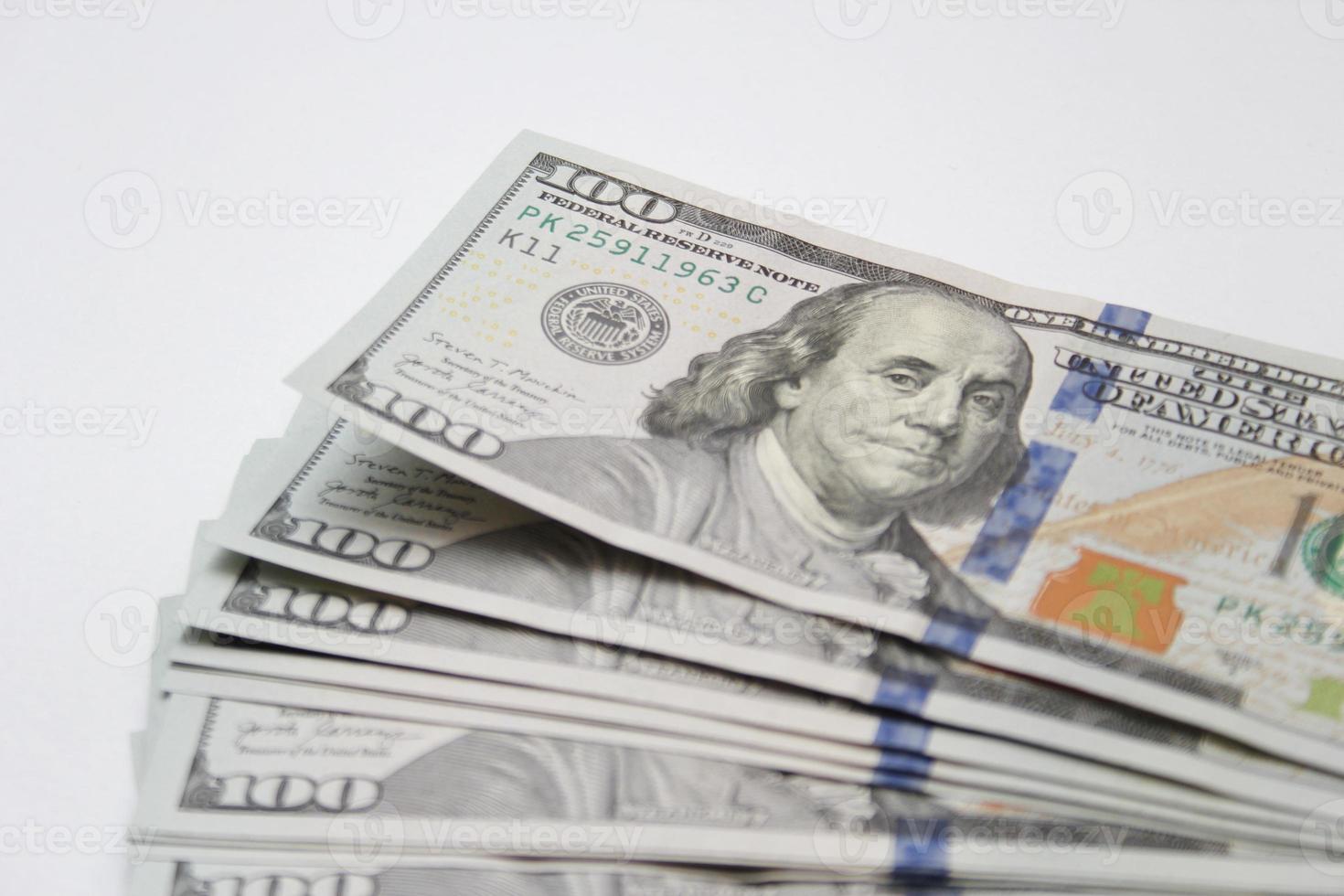 100 dollar US banknotes placed on a white background. photo