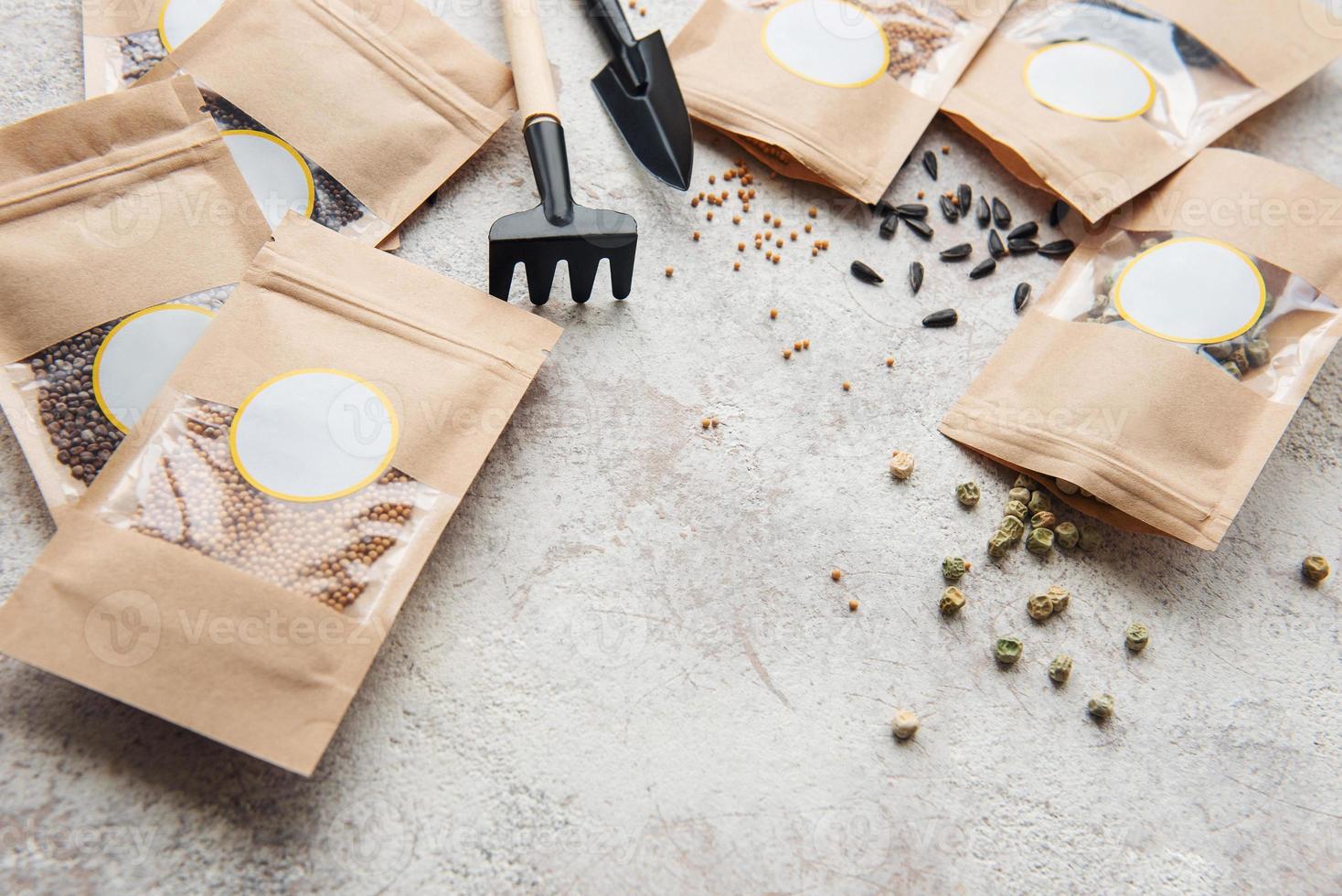 Microgreen seeds in paper bags and equipment for sowing microgreens. photo