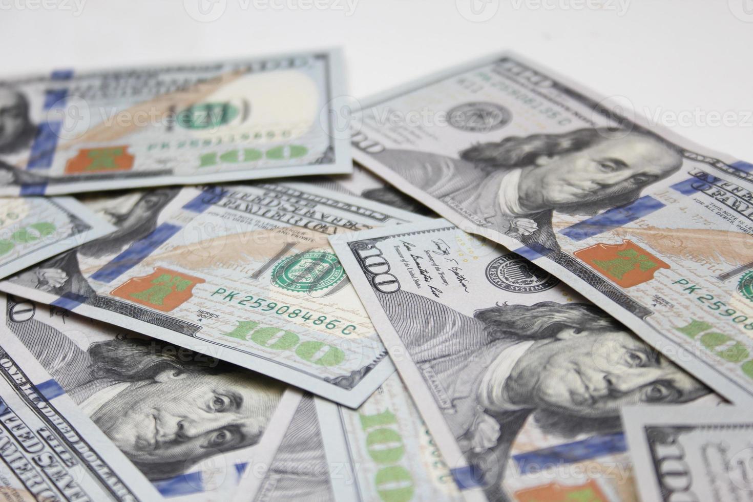 100 dollar US banknotes placed on a white background. photo