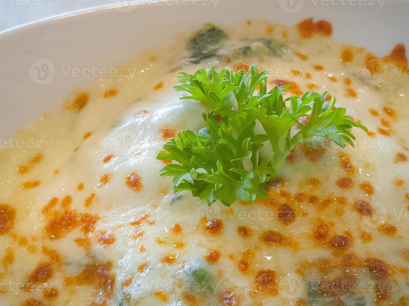 Spinach with cheese in white bowl on wood plate  Flat Lay image. photo