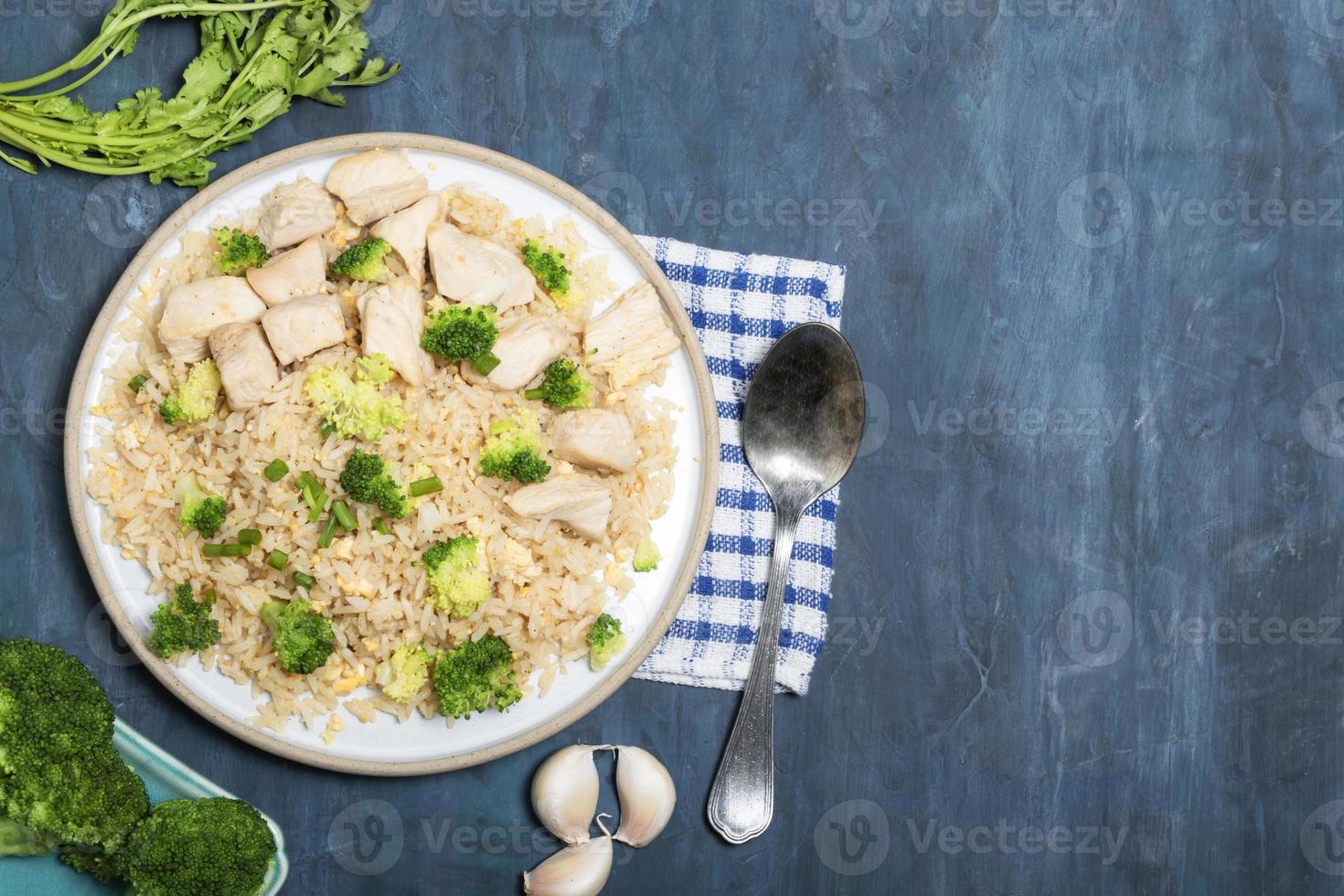 Healthy food fried rice with chicken breast have vegetable on wood table. photo