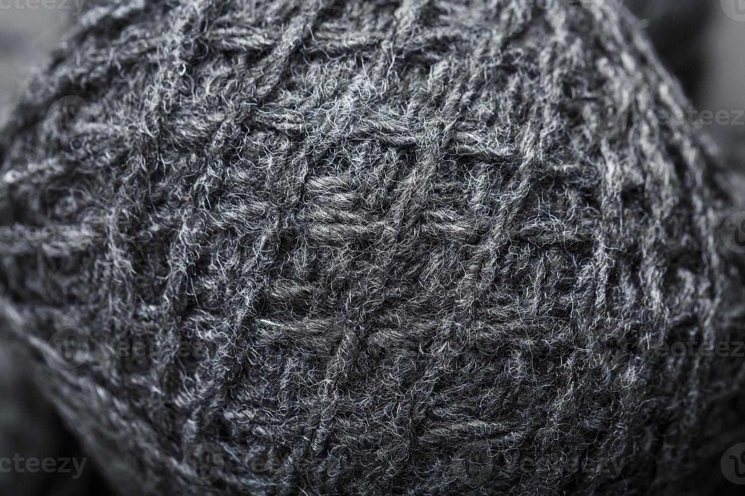 Gray yarn made of natural wool in balls of thread. photo