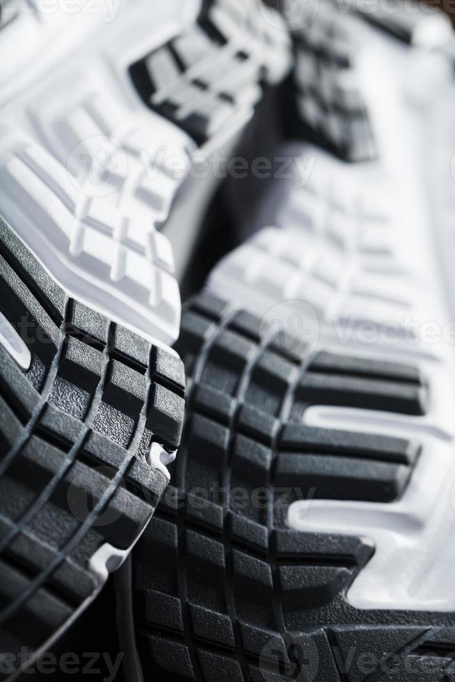 The sole of the sports sneakers for running in black and white close-up photo