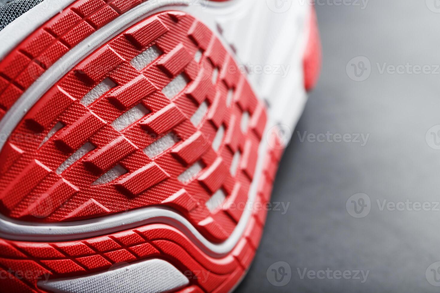 Running shoes with red soles on a black background. 10711809 Stock