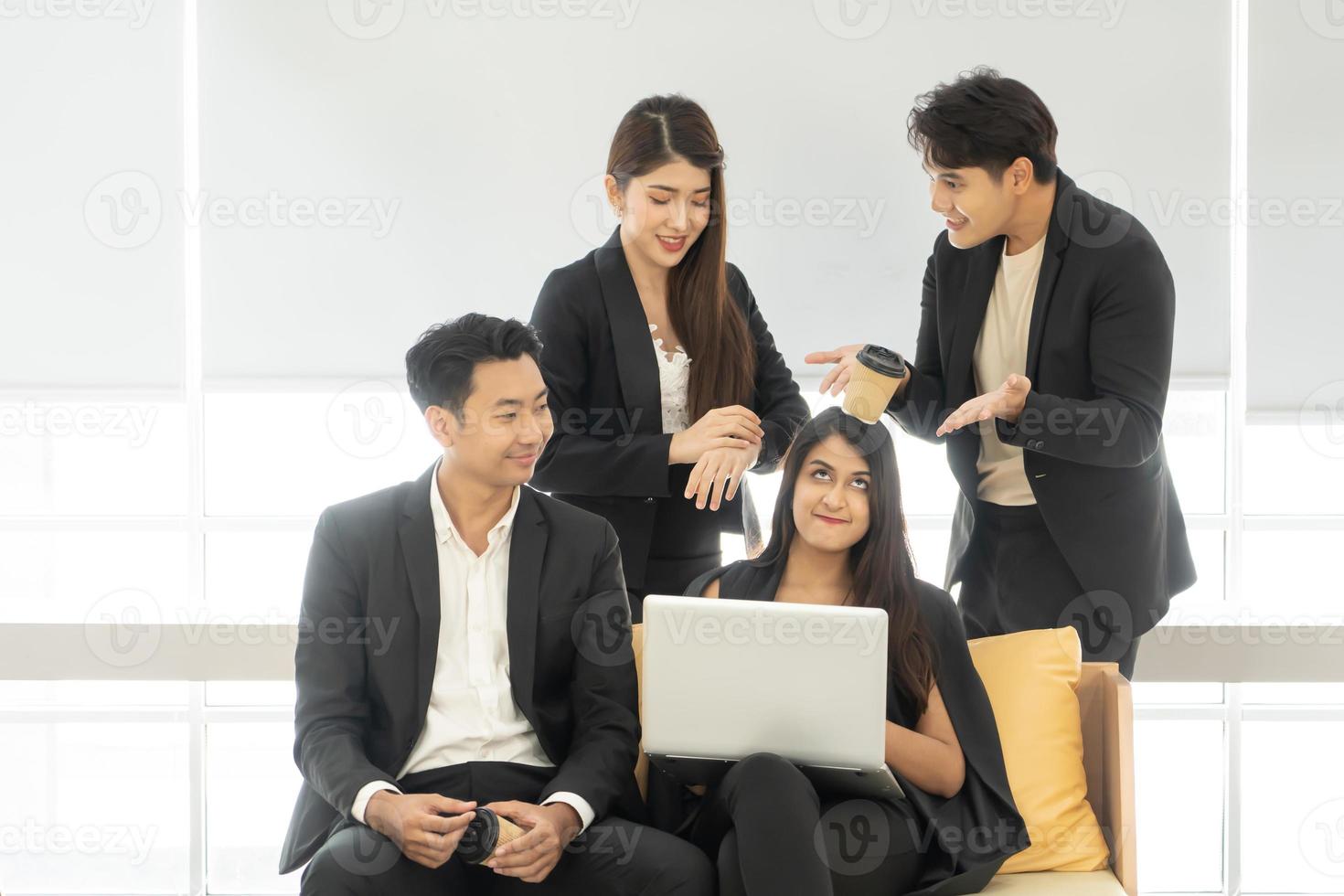 Happy office concept - concentrated business team with laptop computers in office. Happy Business team of entrepreneurs working together. Funny moment in business. photo