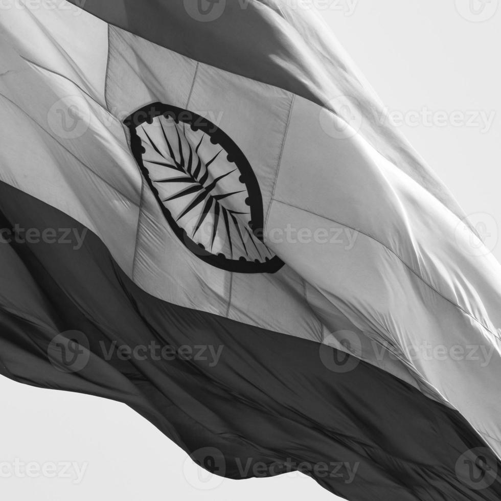 India flag flying at Connaught Place with pride in blue sky, India flag fluttering, Indian Flag on Independence Day and Republic Day of India, waving Indian flag, Flying India flags - Black and White photo