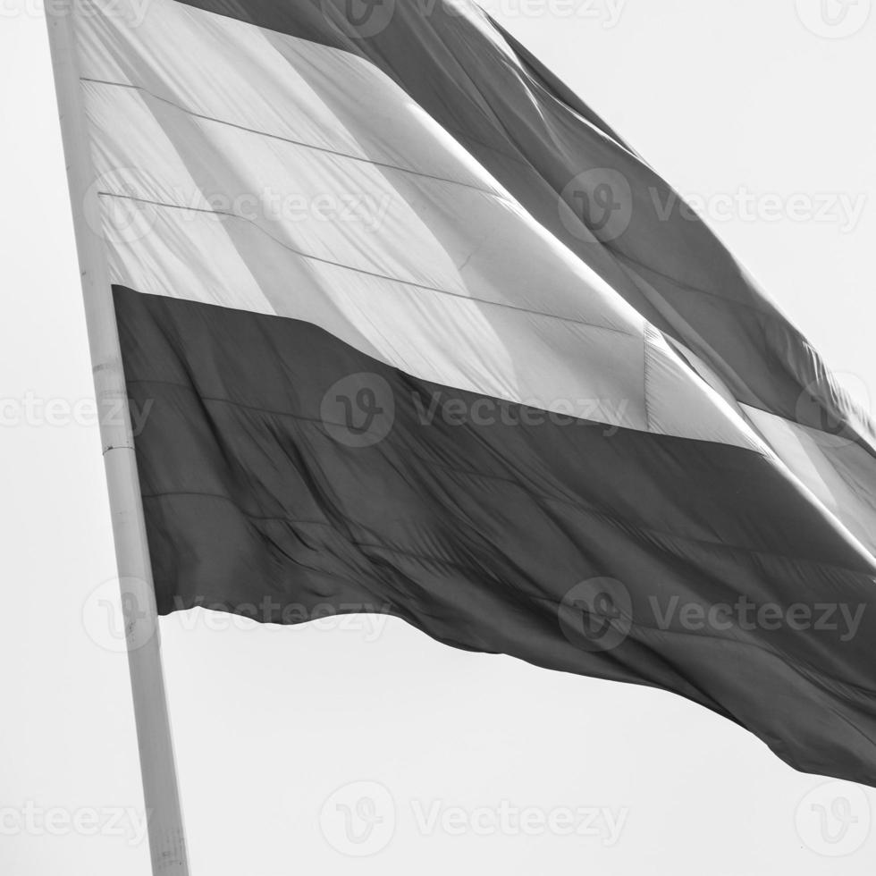 India flag flying at Connaught Place with pride in blue sky, India flag fluttering, Indian Flag on Independence Day and Republic Day of India, waving Indian flag, Flying India flags - Black and White photo