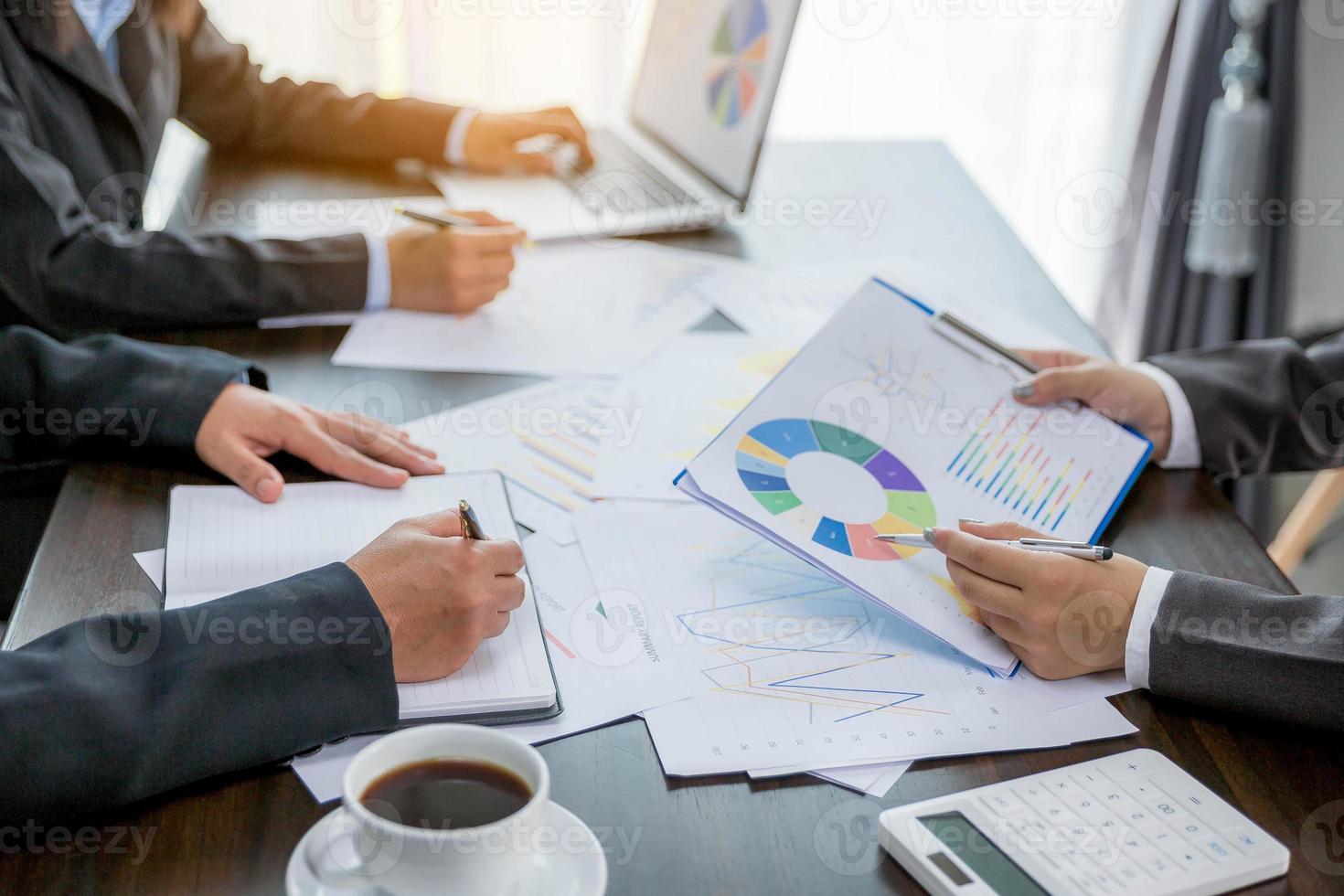 Group professional business people person working together to analyze in office, work together to discuss company financial statistics report, brainstorm ideas, and graph datum documents on the table. photo
