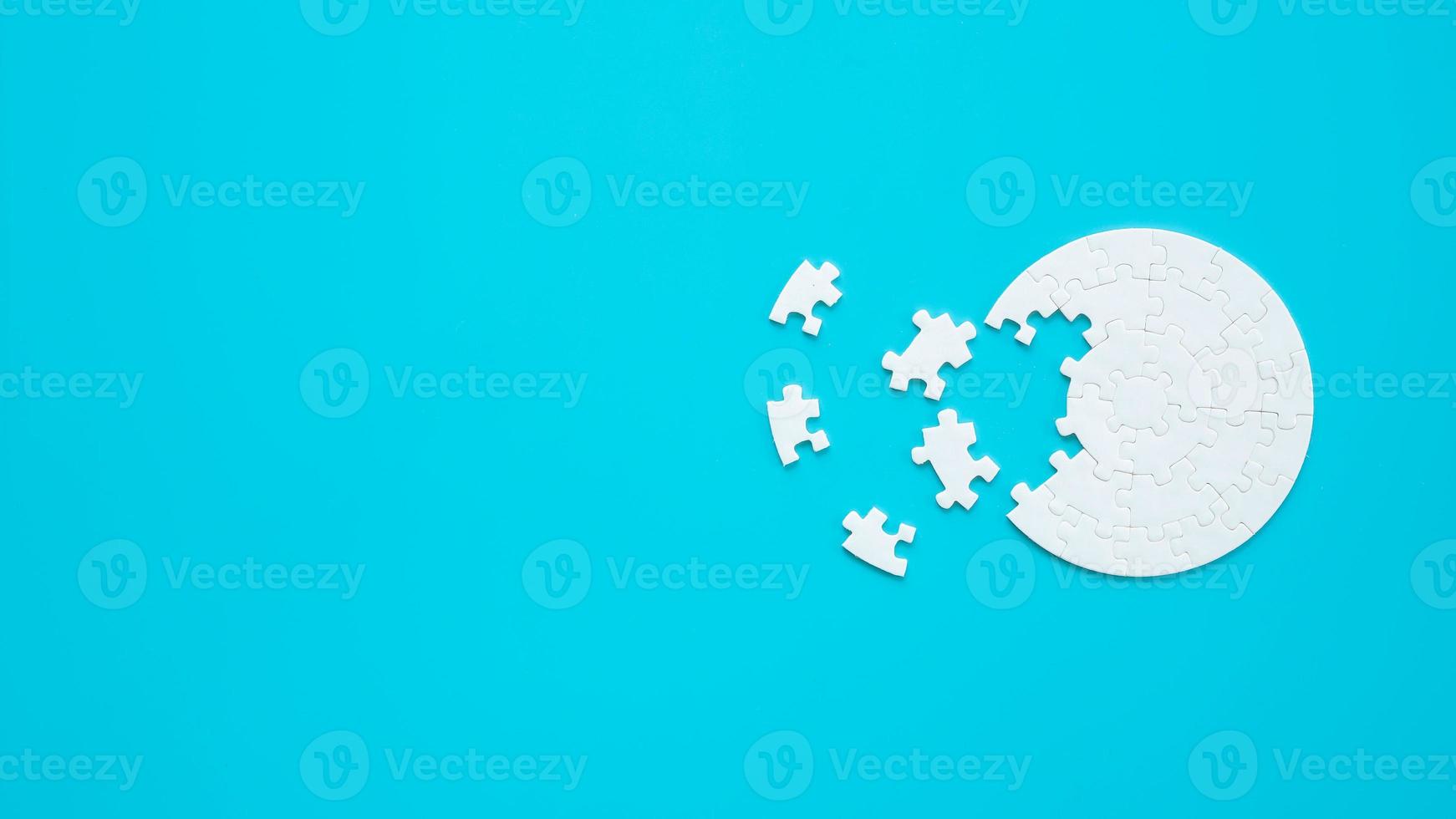 White part of jigsaw puzzle pieces on blue background. concepts of problem solving, business success, teamwork, Team playing jigsaw game incomplete, Texture photo with copy space for text