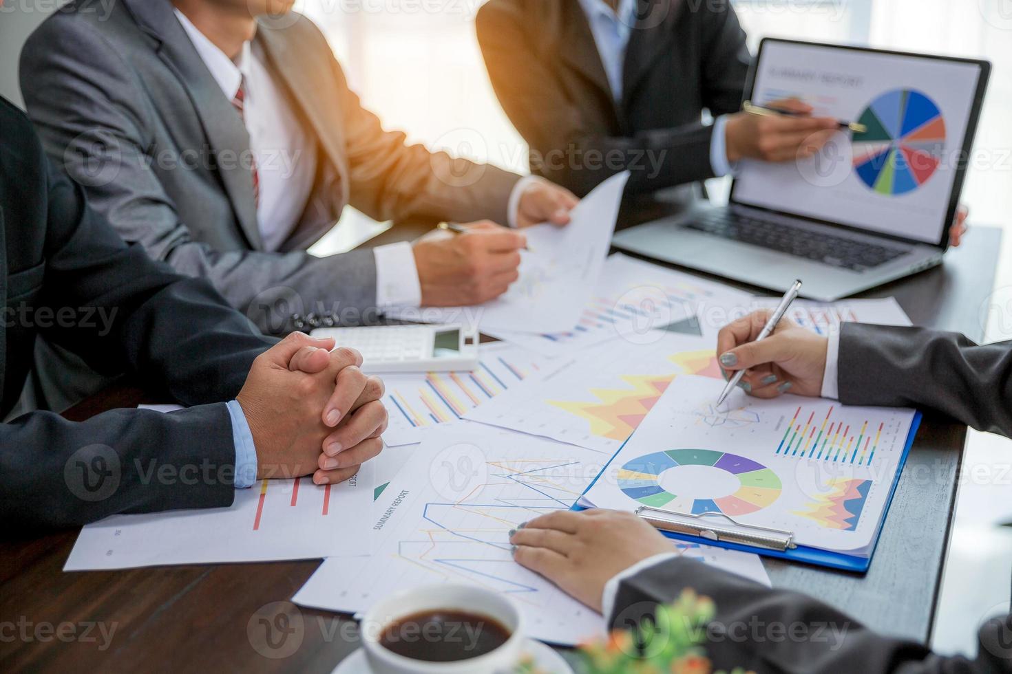 Group professional business people person working together to analyze in office, work together to discuss company financial statistics report, brainstorm ideas, and graph datum documents on the table. photo