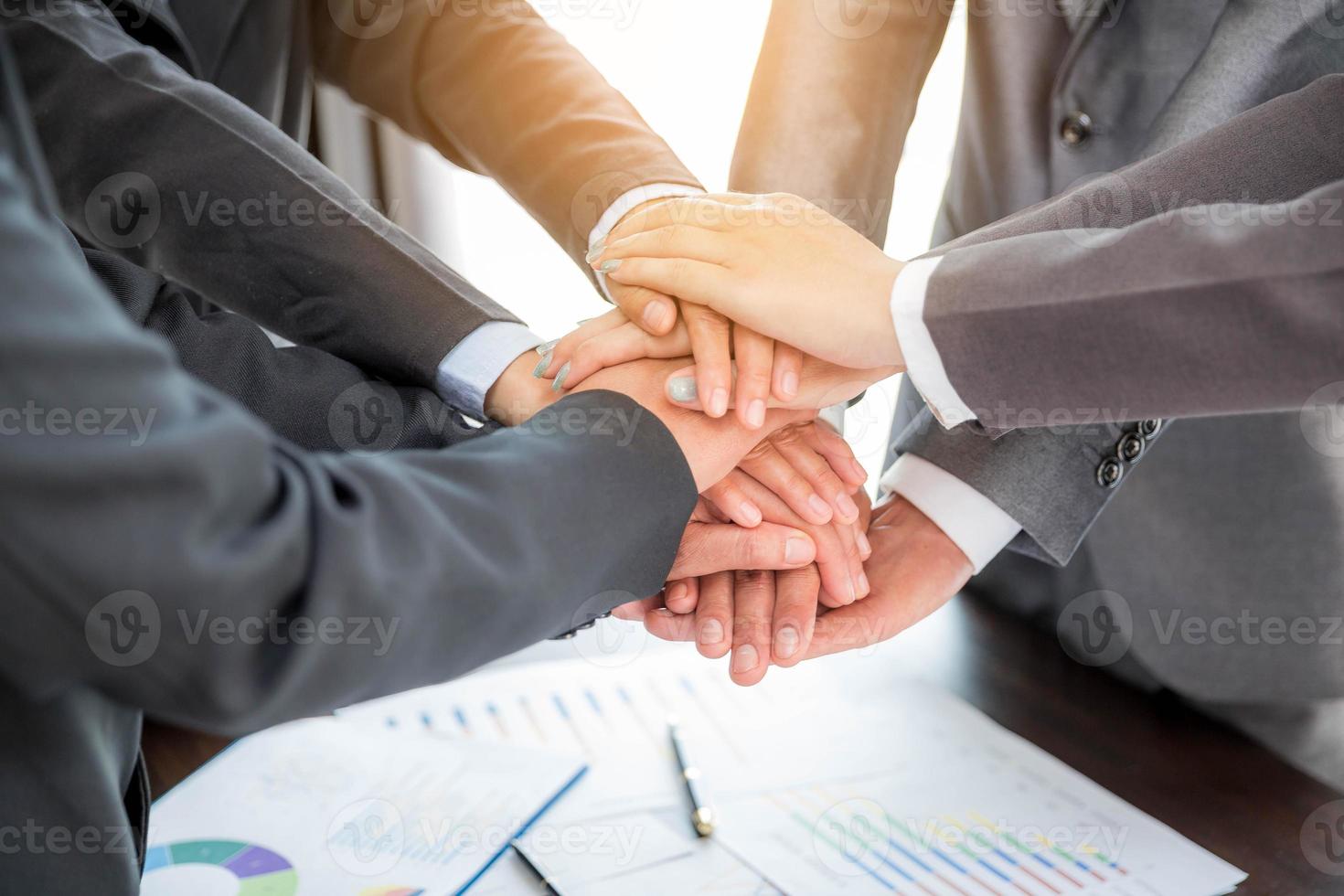 Close-up of group hand success business people person working together in office. Diversity of businessman and businesswoman attending corporate meetings. concept of friendship, cooperation corporate. photo