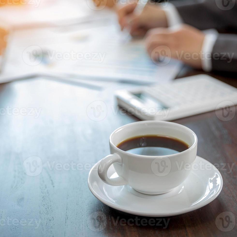 Group professional business people person working together to analyze in office, work together to discuss company financial statistics report, brainstorm ideas, and graph datum documents on the table. photo