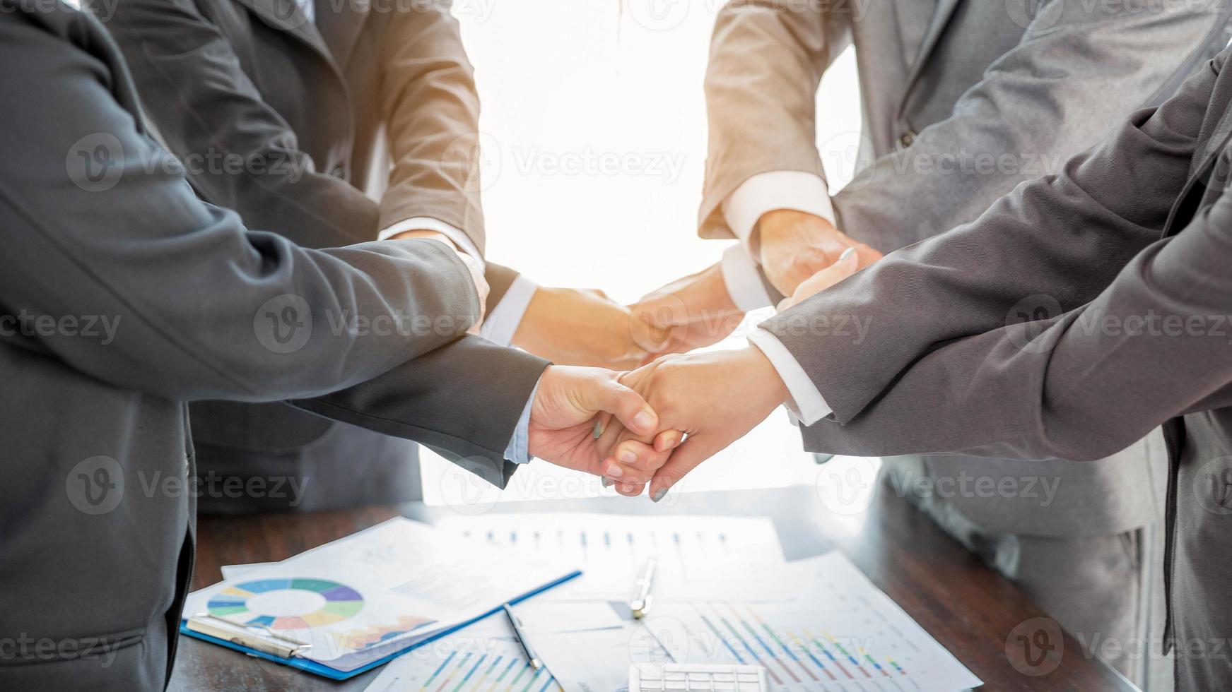 Close-up of group hand success business people person working together in office. Diversity of businessman and businesswoman attending corporate meetings. concept of friendship, cooperation corporate. photo