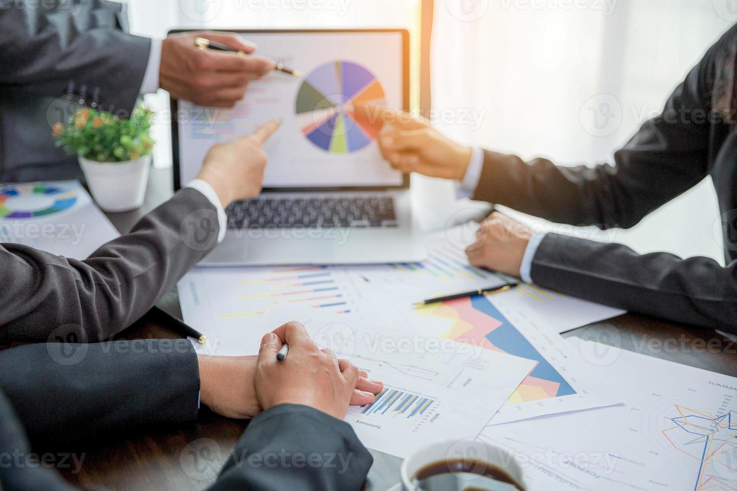 Group professional business people person working together to analyze in office, work together to discuss company financial statistics report, brainstorm ideas, and graph datum documents on the table. photo