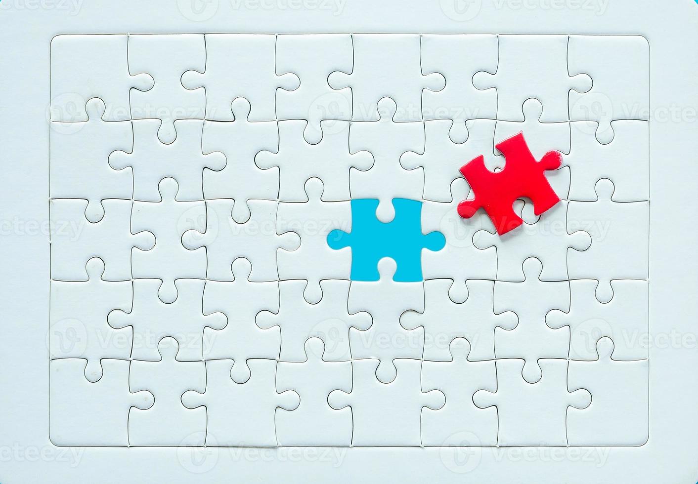 White part of jigsaw puzzle pieces on blue background. concepts of problem solving, business success, teamwork, Team playing jigsaw game incomplete, Texture photo with copy space for text
