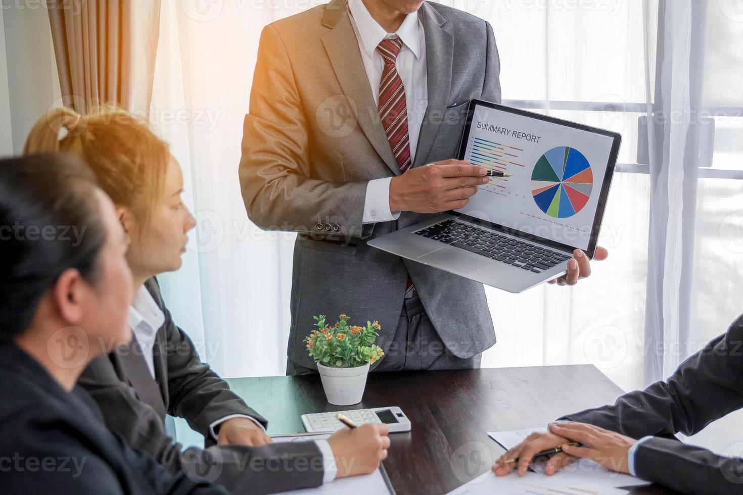 Group professional business people person working together to analyze in office, work together to discuss company financial statistics report, brainstorm ideas, and graph datum documents on the table. photo