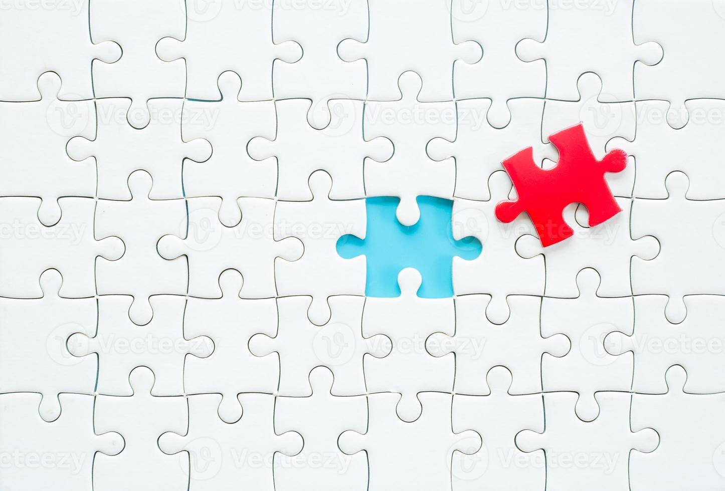 White part of jigsaw puzzle pieces on blue background. concepts of problem solving, business success, teamwork, Team playing jigsaw game incomplete, Texture photo with copy space for text