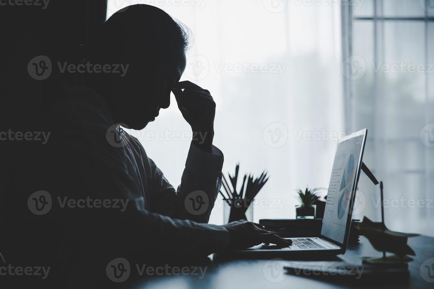 Stress business woman person from hard work, depression in office. Tired and anxious employee female with unhappy at problem job. young businesswoman sitting sad front of laptop computer on desk. photo