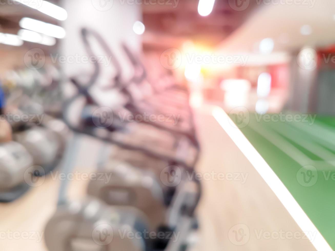 Abstract blur fitness gym equipment background photo