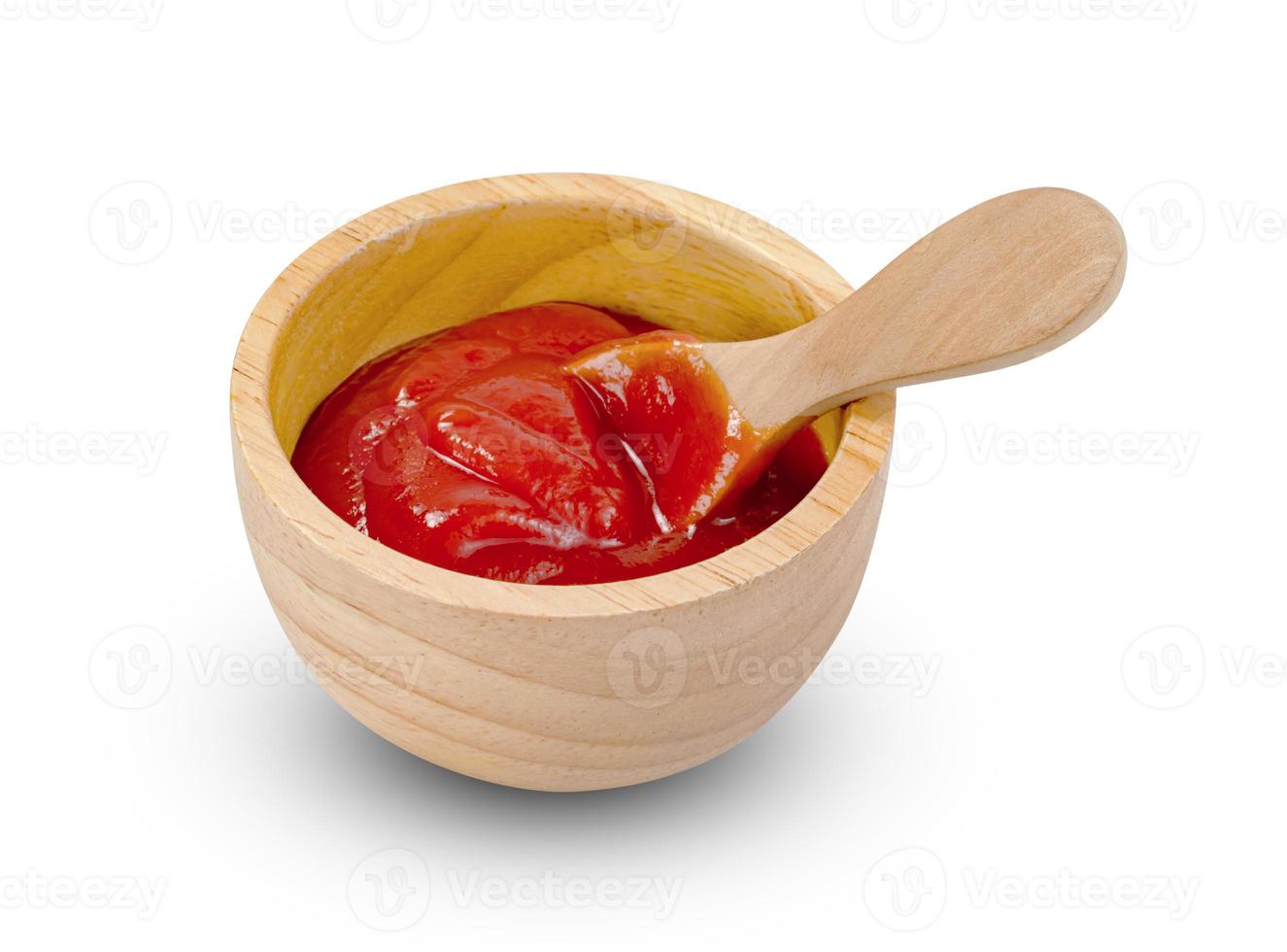 tomato sauce in wooden bowl and spoon isolated on white background ,include clipping path photo