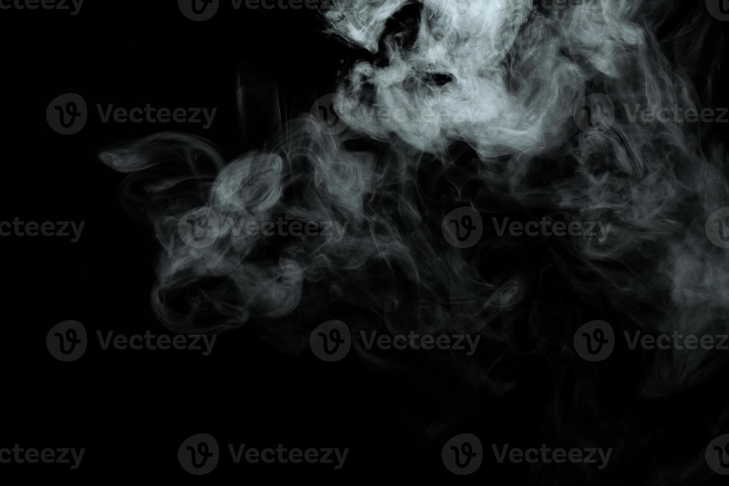 Abstract powder or smoke isolated on black background photo