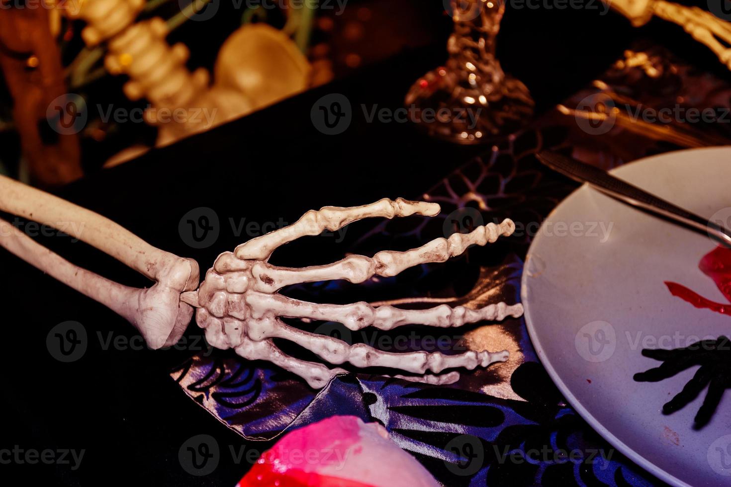 Right hand bone on tableware,Halloween day photo