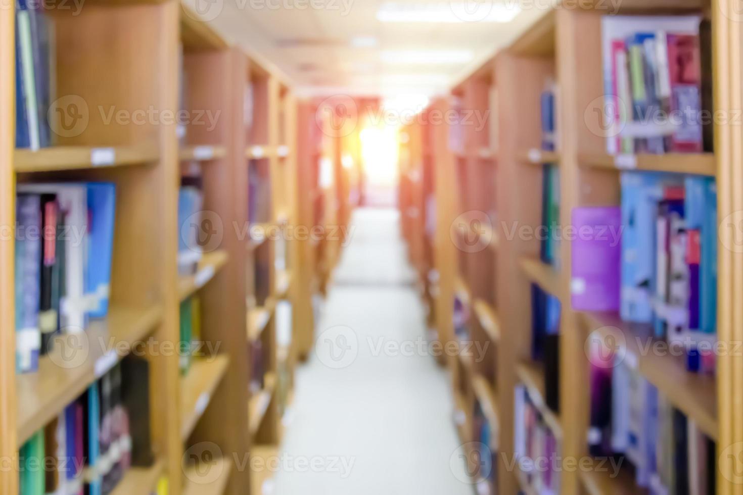 shelf with books in the library blurred background photo