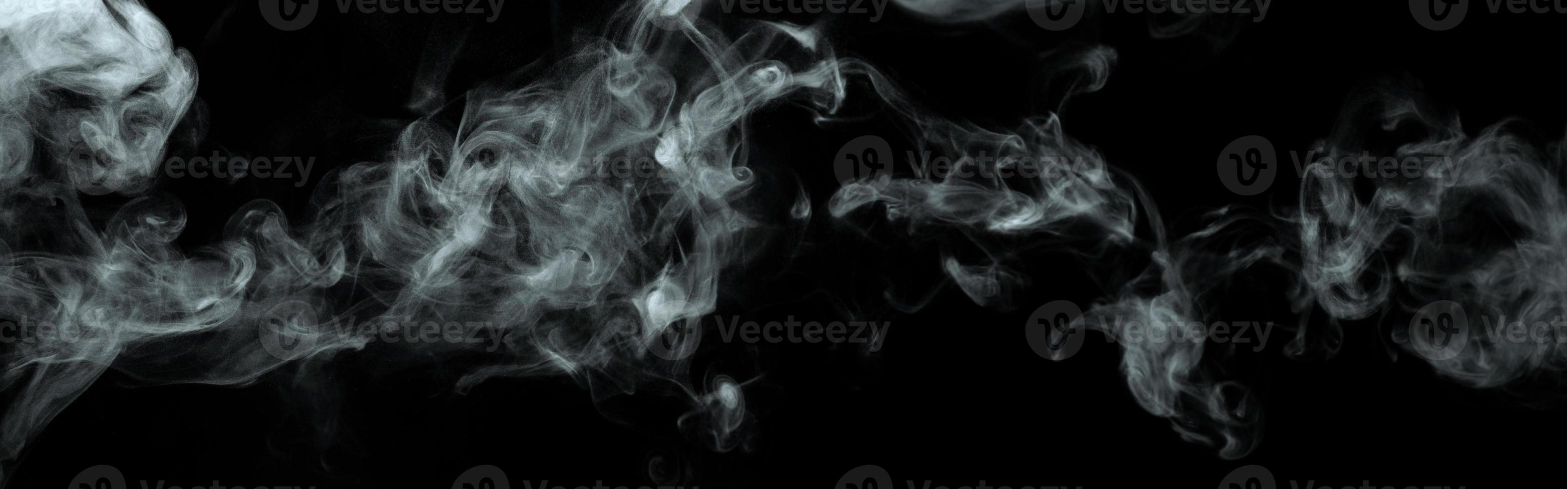 Abstract powder or smoke isolated on black background photo