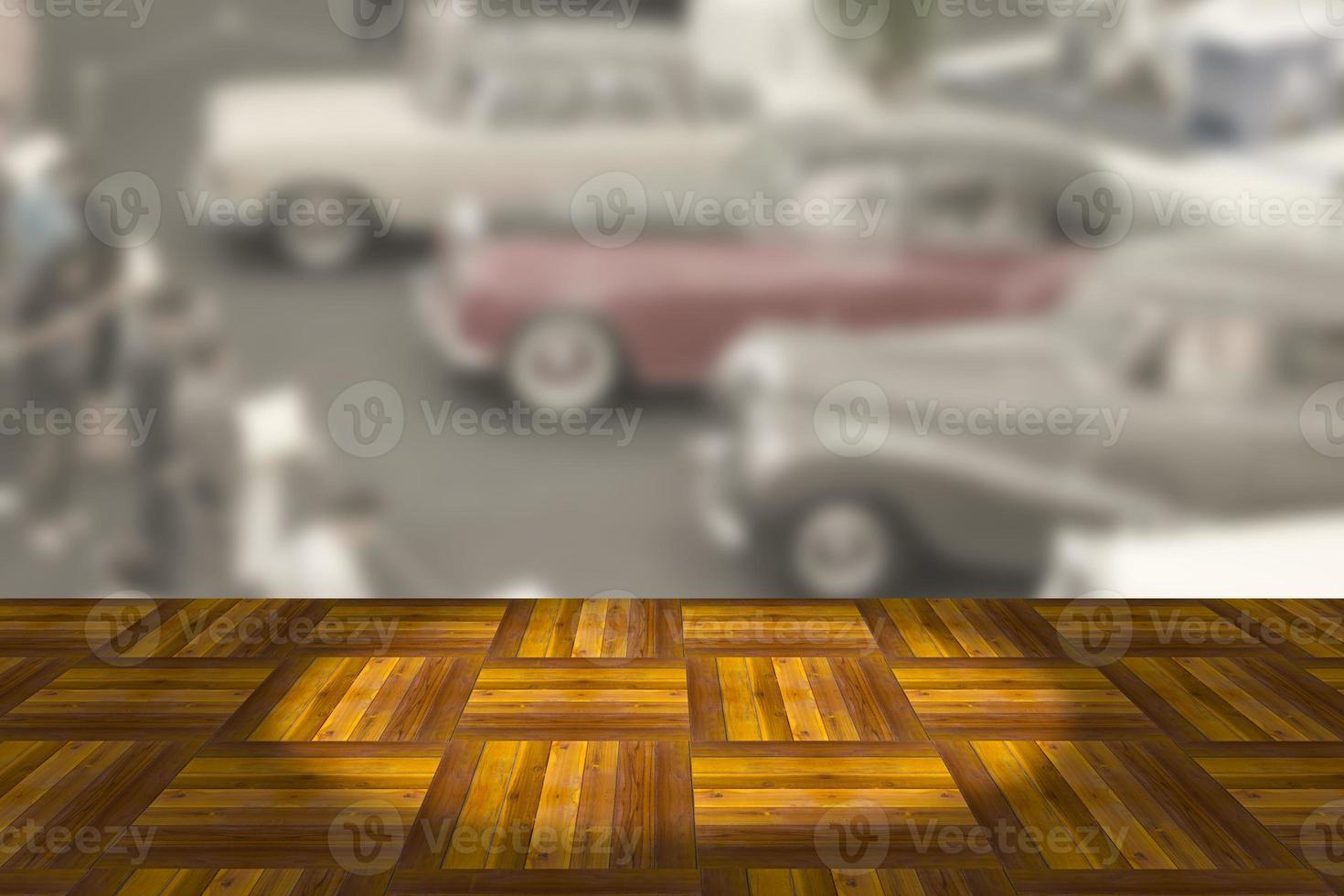 Empty wooden board space platform with vintage car show room blurry background photo