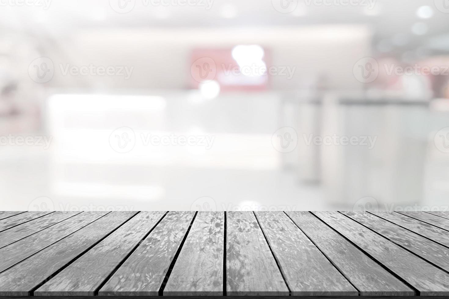 Empty wooden board space platform with register counter blurry background photo