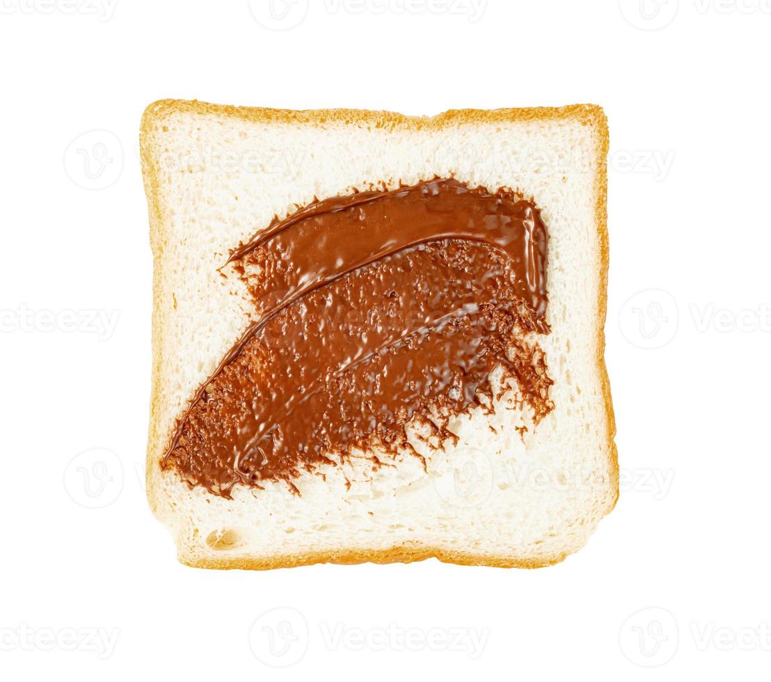 Toasted slice bread with chocolate spread isolated on white background photo