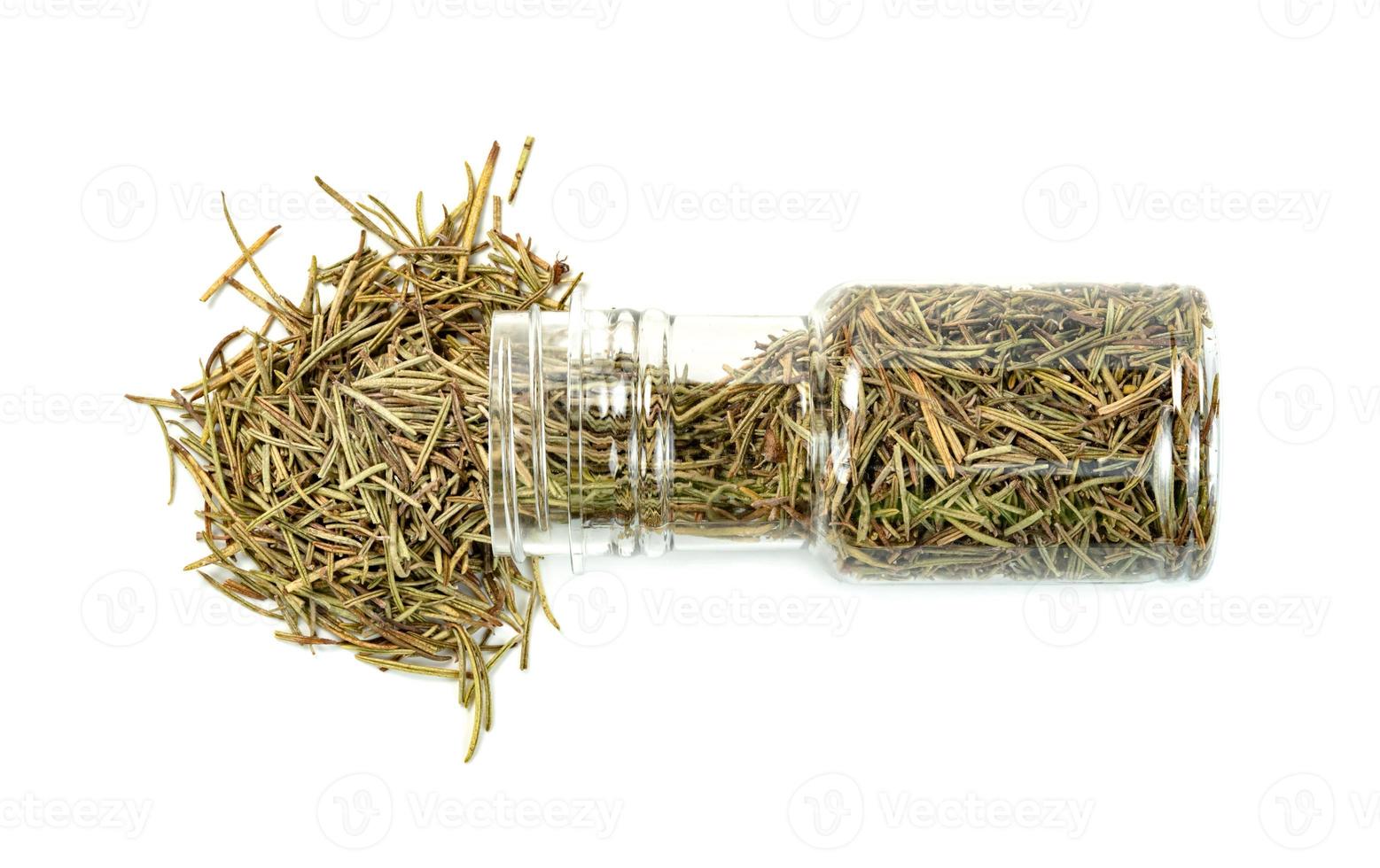 Dry rosemary in plastic bottle isolated on white background photo