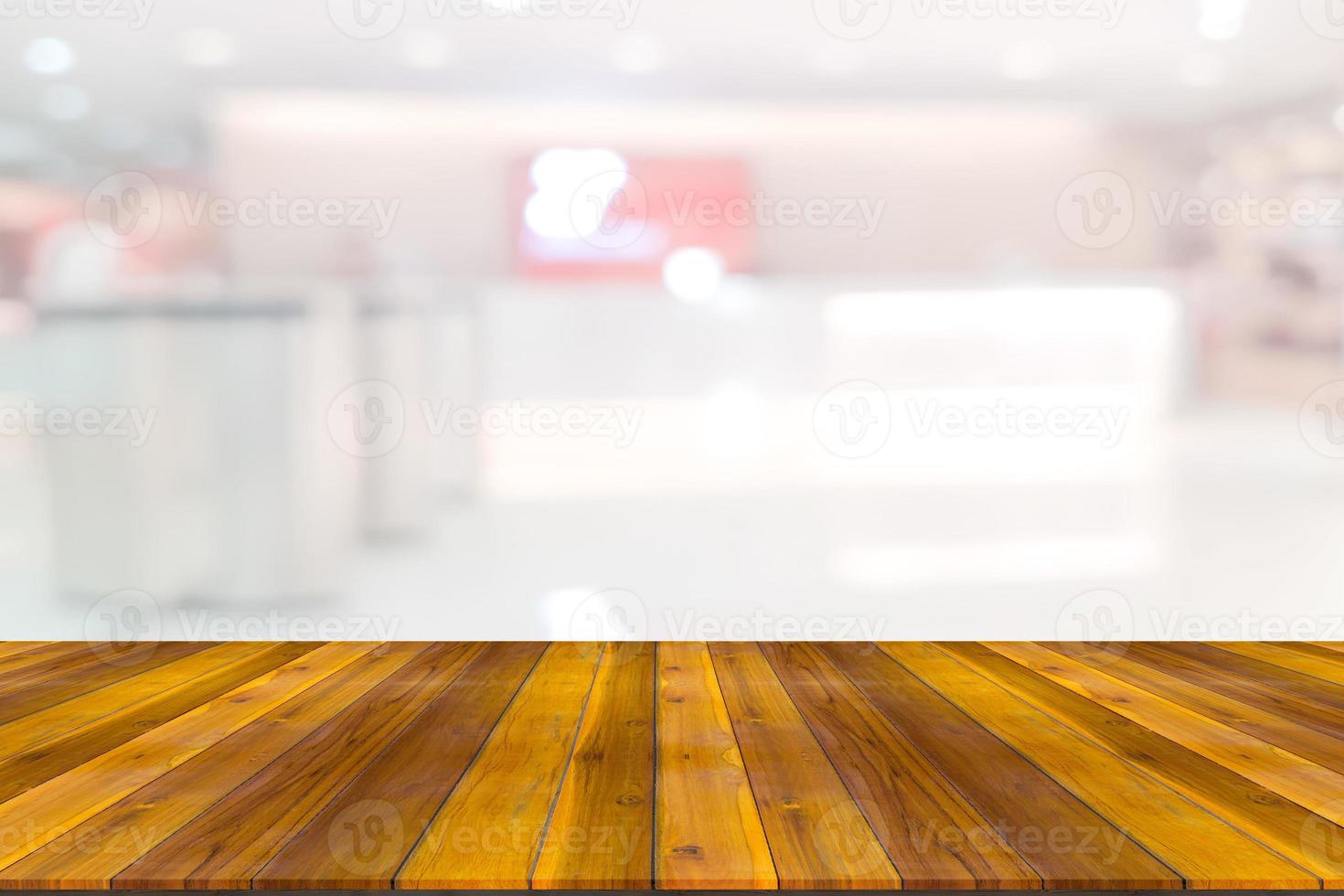 Empty wooden board space platform with register counter blurry background photo