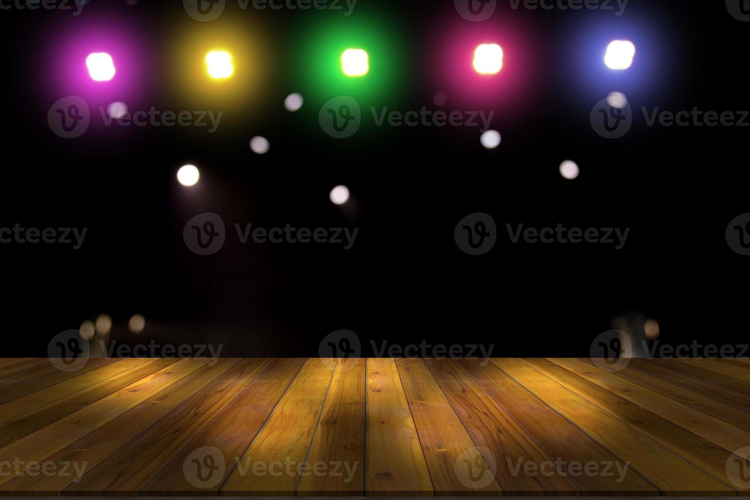 top desk with light bokeh in concert blur background,wooden table photo
