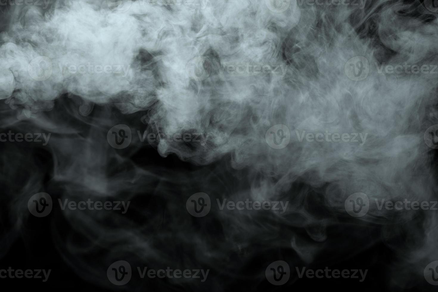Abstract powder or smoke isolated on black background photo