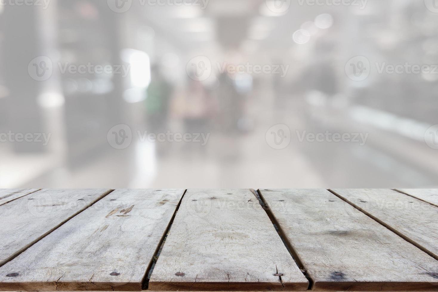 gray wood backgroundsEmpty wooden board space platform with shopping mall blurred background photo