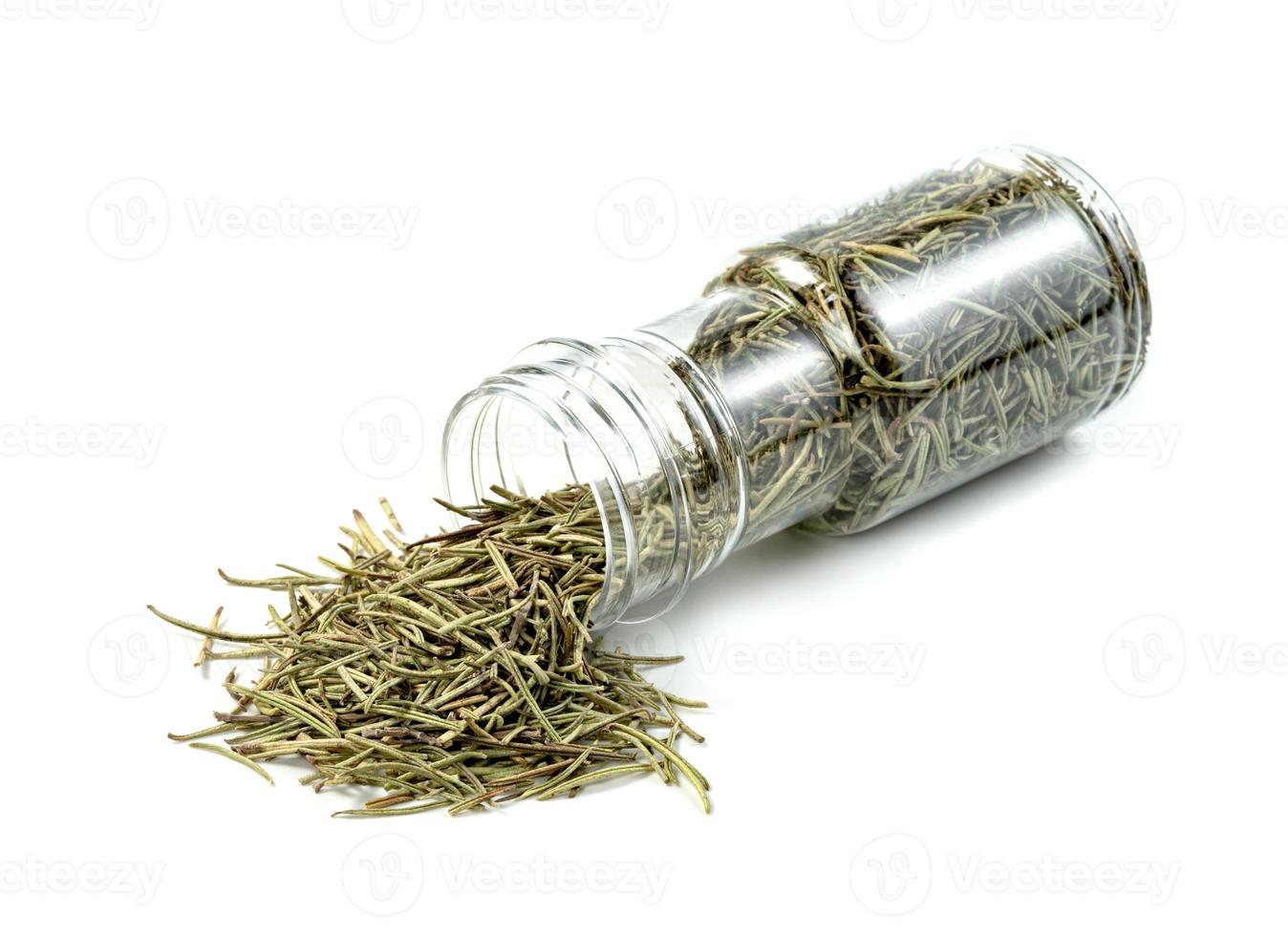 Dry rosemary in plastic bottle isolated on white background photo