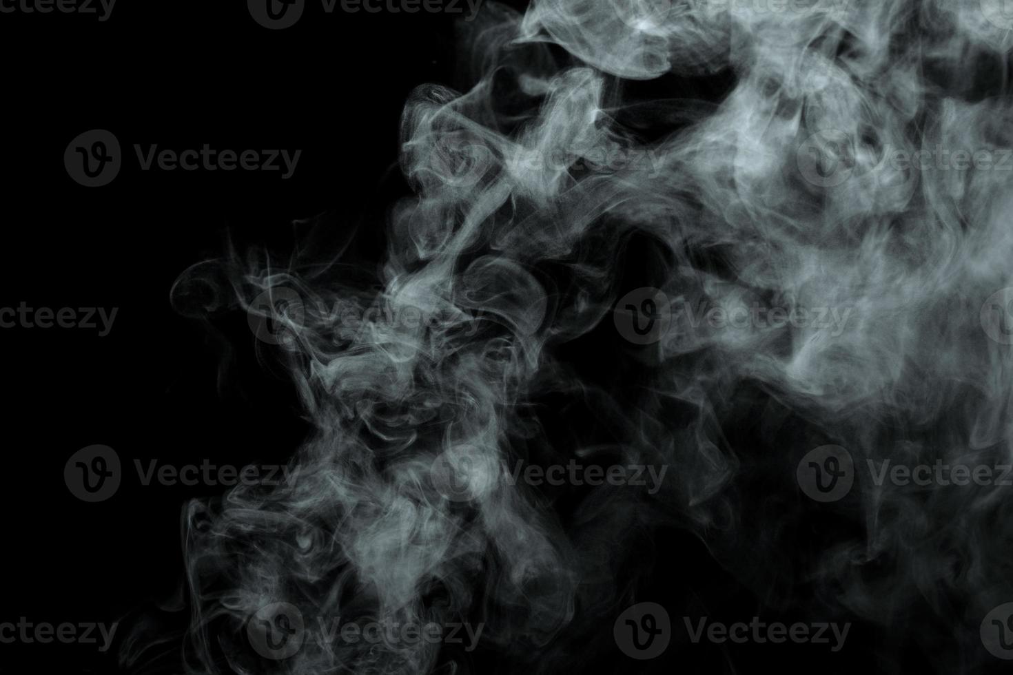 Abstract powder or smoke isolated on black background photo