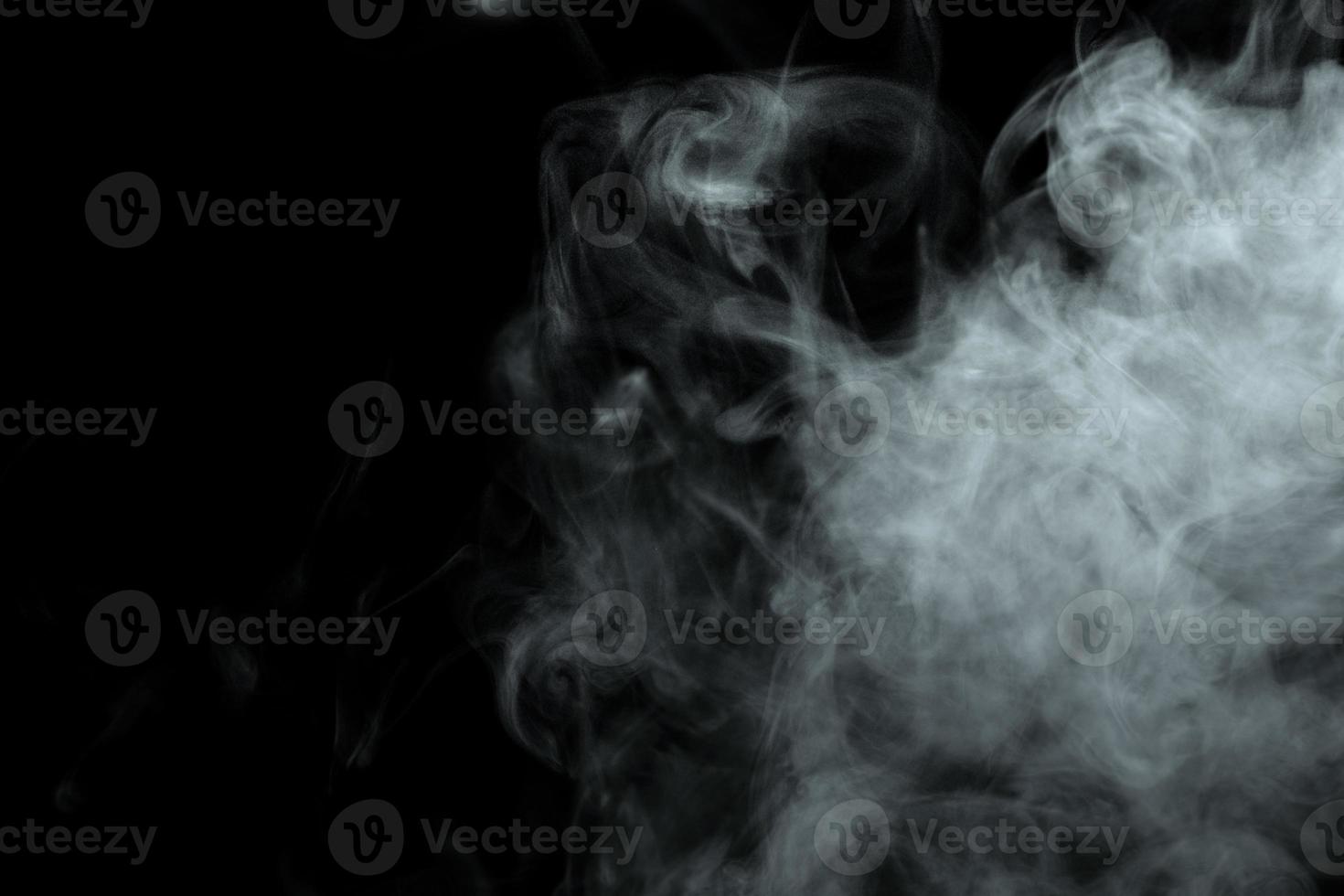 Abstract powder or smoke isolated on black background photo