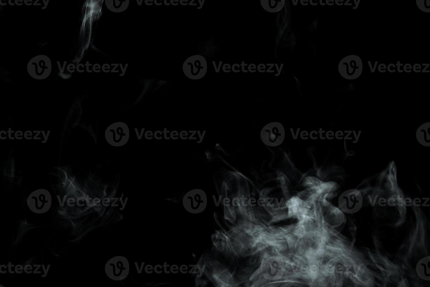 Abstract powder or smoke isolated on black background photo